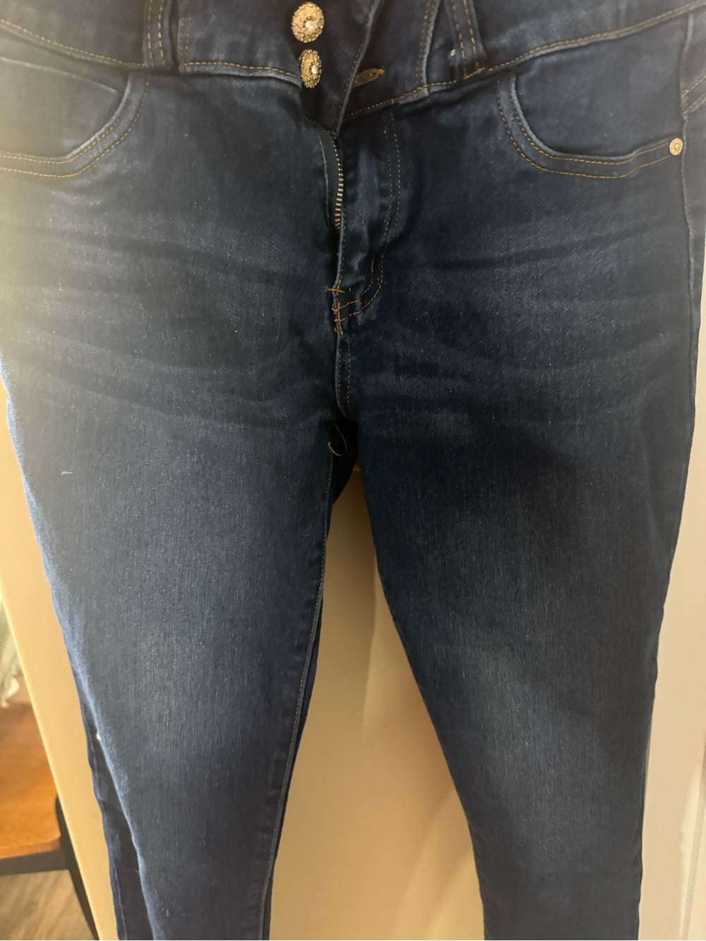 Bella high-rise skinny jeans feature a dark blue denim wash (CL-3)